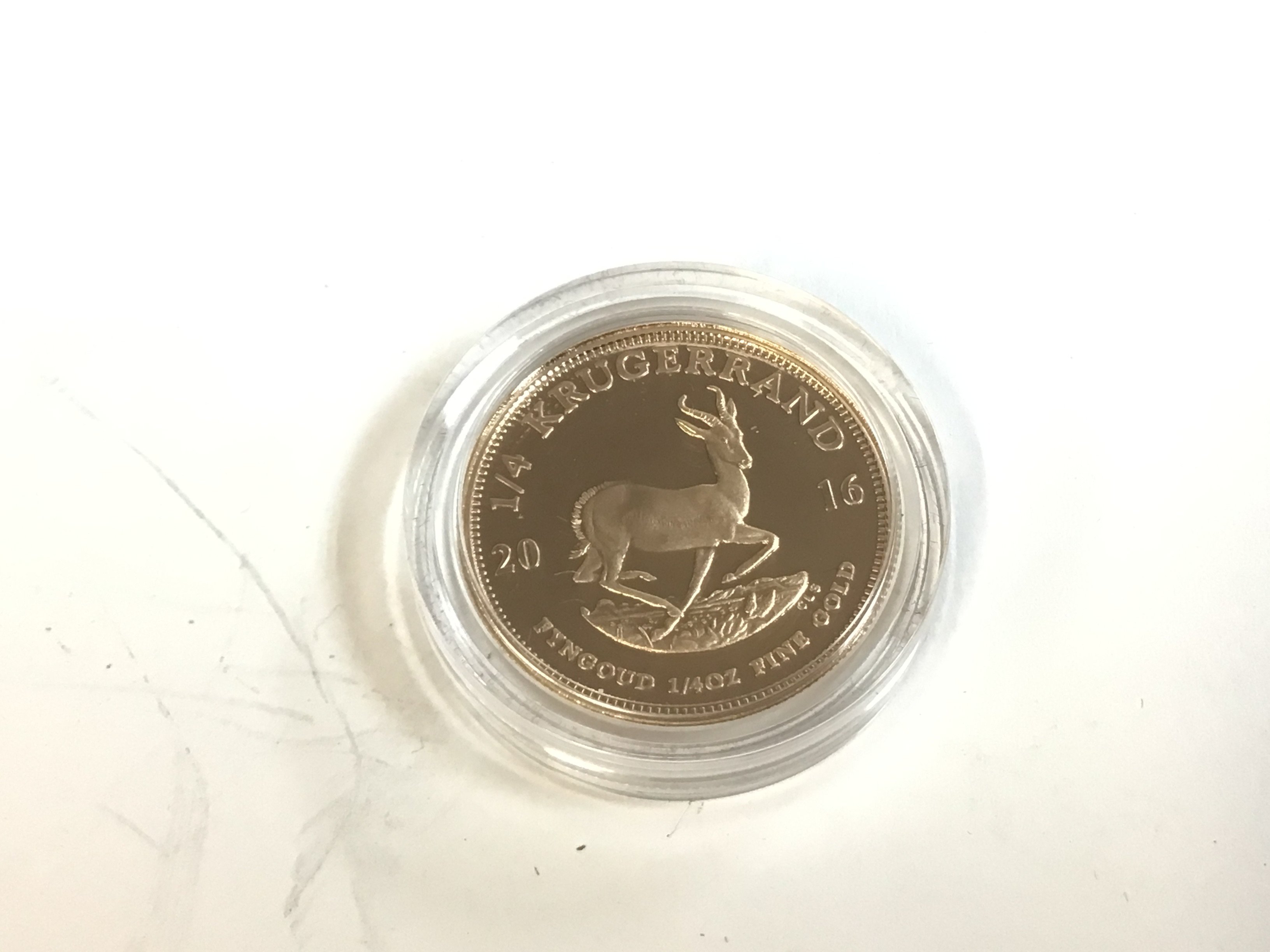 A 1/4 oz gold krugerrand from 2016. Postage A