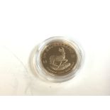 A 1/4 oz gold krugerrand from 2016. Postage A