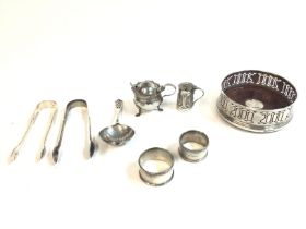 A collection of assorted silver items including to