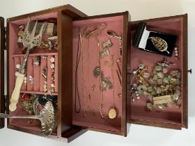 A wooden jewel casket and contents to include vari