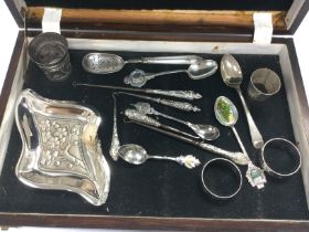 A box of mixed silver items including a small dish