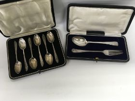 Four cased sets of silver spoons.