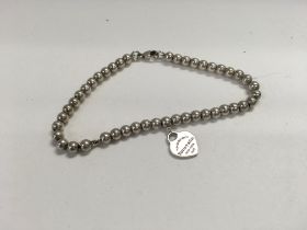 A silver Tiffany & co bracelet.