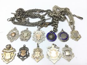 A collection of silver hallmarked watch chains and