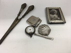 A collection of mixed silver items including a ves