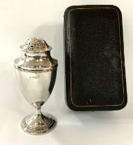 A Hallmarked silver cased sugar caster, with marks
