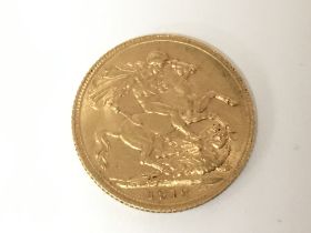A 1912 full sovereign. Postage A