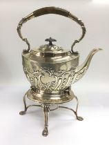 A silver kettle on stand, Sheffield hallmarks. Shi