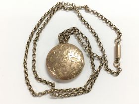 9ct yellow gold round patterned locket, on an 18 i