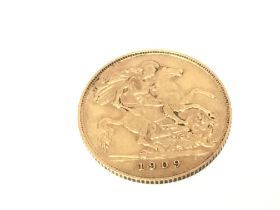 A 1906 half sovereign. Postage A