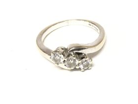 An 18ct white gold 3 diamonds ring. Size N 1/2 and