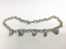 A Tiffany charm necklace. Shipping category A.