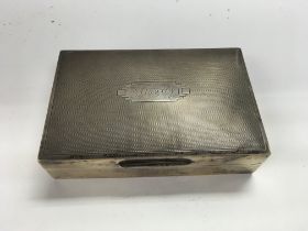 A silver cigarette box, approximately 13.5cm x 9cm