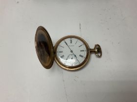 A gold plated hunter pocket watch.