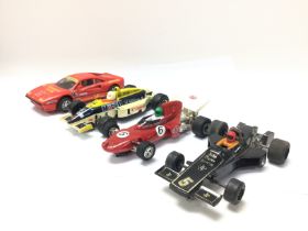 Four vintage Scalextric cars including John Player