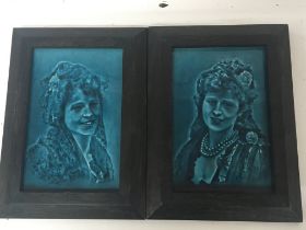 A pair of framed early 20th century ceramic portra