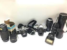 A collection of vintage cameras including Pentax M