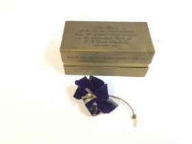 A purple flower made from the actual velvet as use