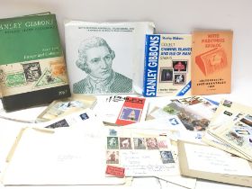 A collection of stamp related items including Stan