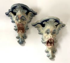 A pair of Italian pottery grotesque wall sconces. 14cm x width 14.5cm