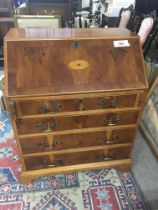 An inlaid Yew Wood bureau with a fall front and fi