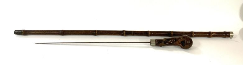 A bamboo and burr wood handled sword stick with trefoil blade.
