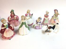 A collection of assorted royal doulton figurines i