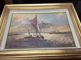 A small framed oil on canvas depicting a barge at