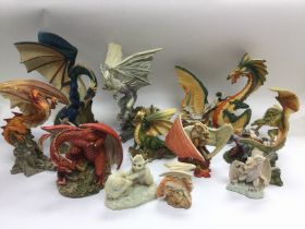 Eleven Enchantica figures of dragons, with boxes.