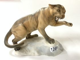 A Beswick porcelain model of a mountain lion. (D)