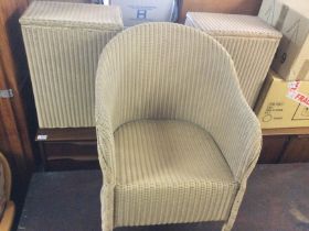 A Lloyd Loom cream bedroom chair and two matching Lloyd Loom laundry baskets (3). Shipping