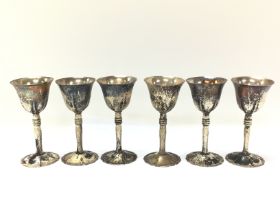 Six white metal cups, possibly Chinese. Approximat