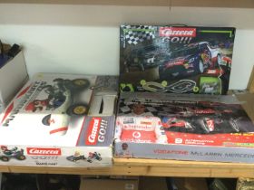 Three boxed racing sets comprising a Carrera Go Ra