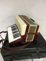 A Cased Vintage Hohner Piccaloa Piano Accordion. In a fitted case.