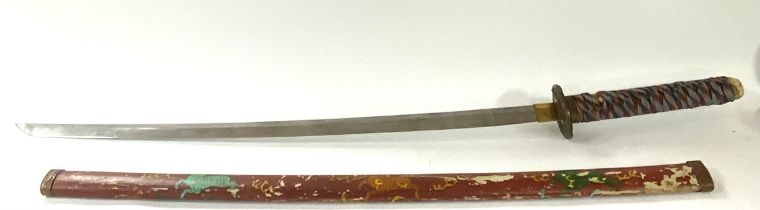 A vintage Samrai sword with painted sheath, stingray skin grip, Bronze Tsuba with decorated blade.