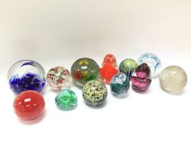 A collection of various vintage paperweights. Post