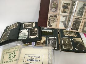 A collection of Postcard albums containing early 2