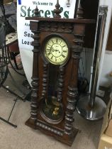 A mahogany cased 8 day wall clock. Shipping catego