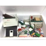 A box of vintage Scalextric accessories. Shipping