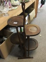 A Mahogany Edwardian five tier folding cake stand.