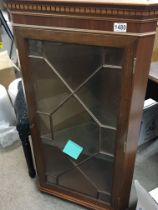 A Mahogany hanging cabinet with a glazed door High