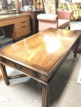 A mahogany table with drawers on sides Approximate