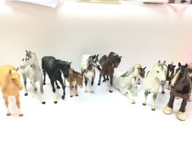 A collection of horses and donkey figures by Beswi