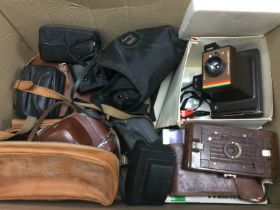 A collection of vintage camera equipment and binoculars. Shipping category D.