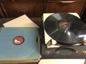 An HMV Table Grand Model 150 gramophone and a collection of 78rpm classical records. Shipping