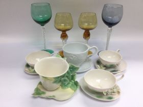 Five Franz porcelain cups and saucers plus four co