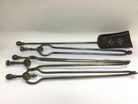 A set of Arts & Crafts style fire irons. Shipping
