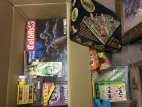 Two boxes of vintage games and toys including a set of wooden tops. Shipping category D.