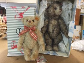 Two Stieff bears, one wearing ribbon