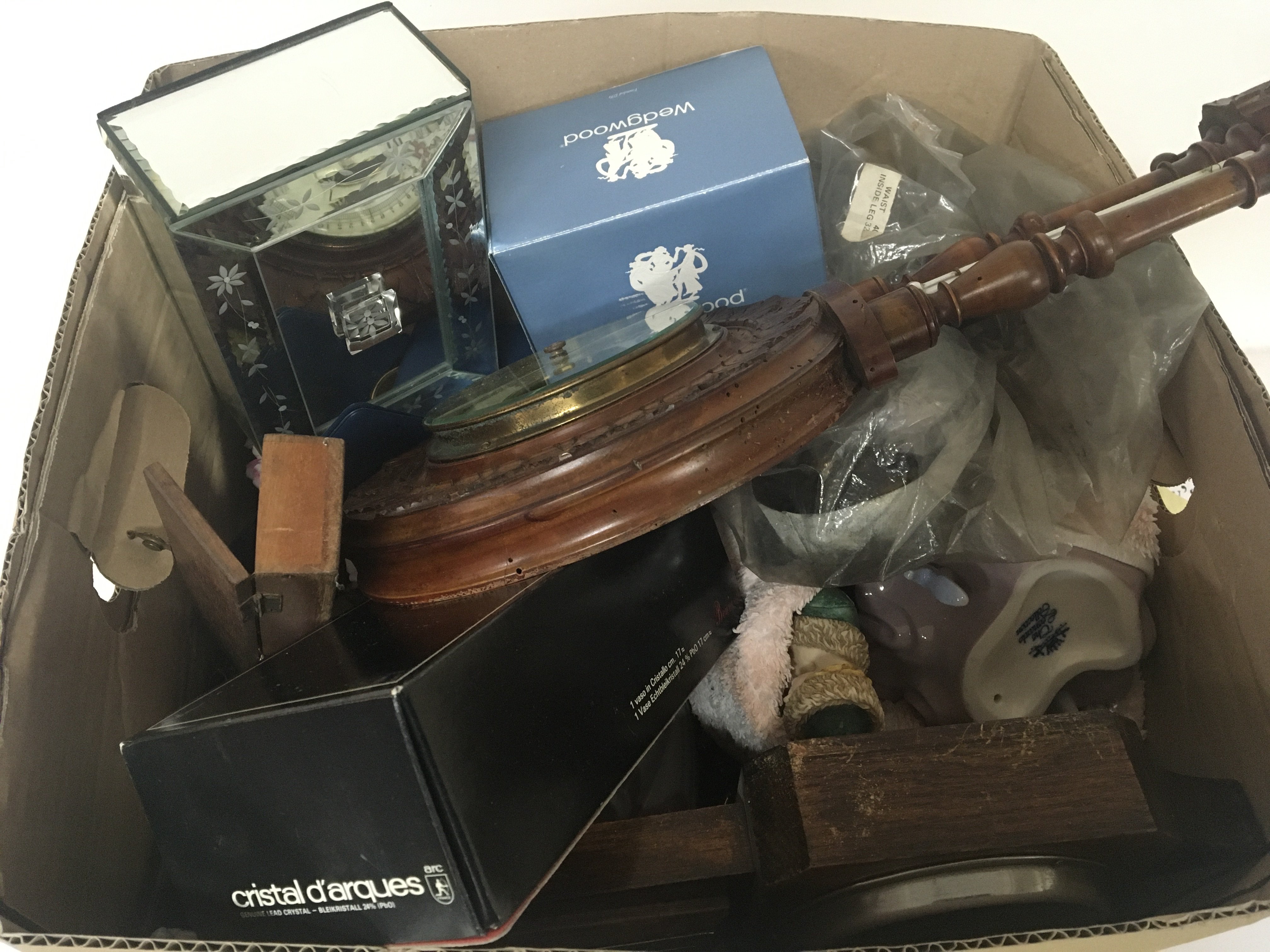 A box containing a quantity of decorative ceramics